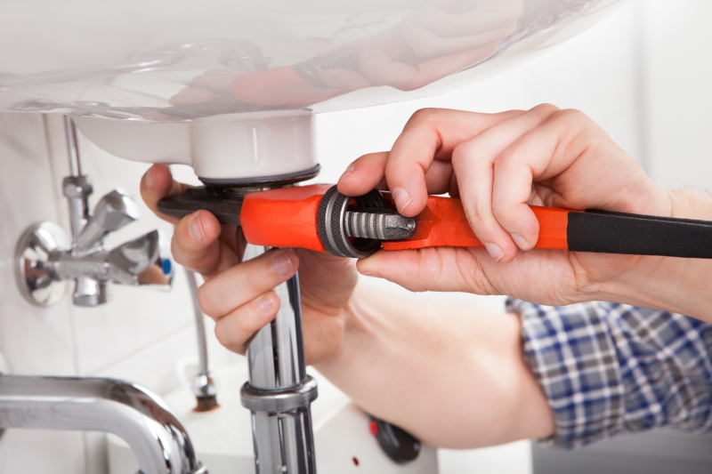 Emergency plumber attending a job in Brentford
